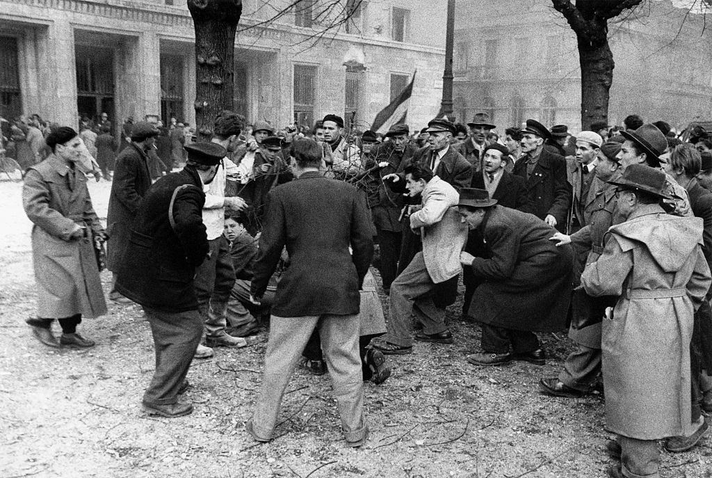 A member of the Hungarian secret police (AVH) is surrounded by the enraged crowd. Budapest, November 1956