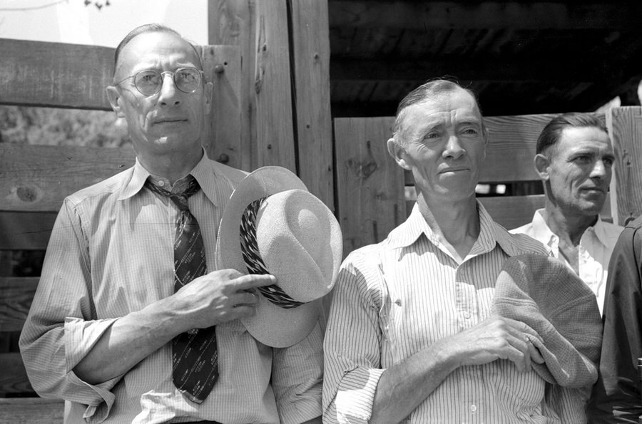 Citizens of Vale, Oregon, take off their hats during the Pledge of Allegiance (radio program) on the Fourth of July, 1941.