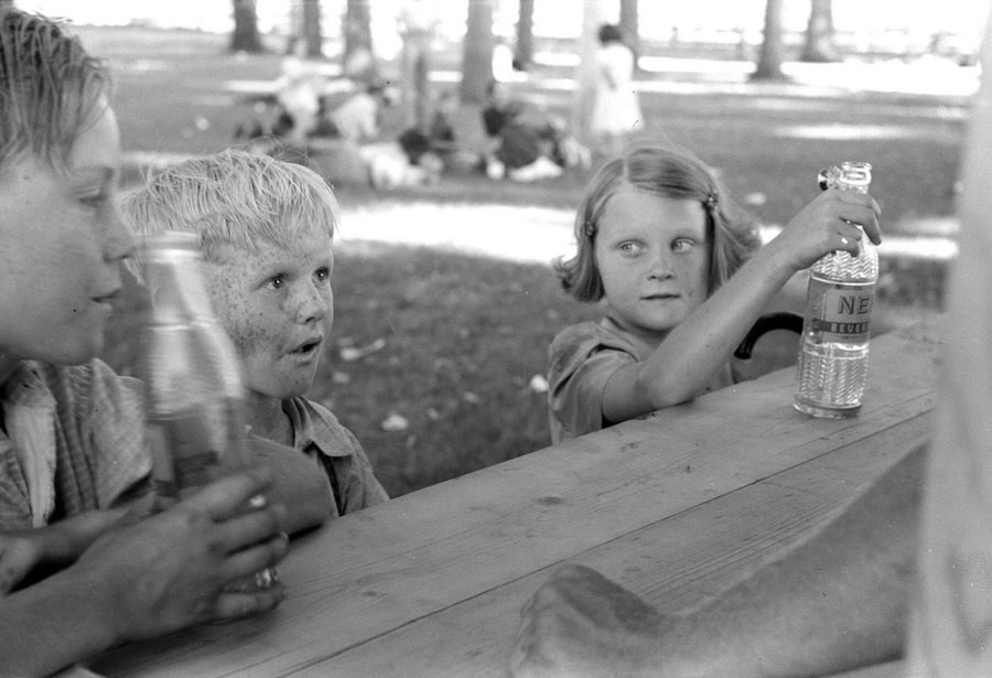 Children enjoy cold sodas at a concession stand after the parade.