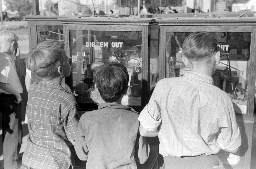 Boys play arcade games.