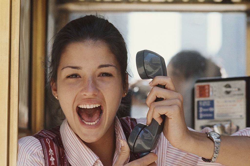 Janice Dickinson holding a telephone receiver, 1975.