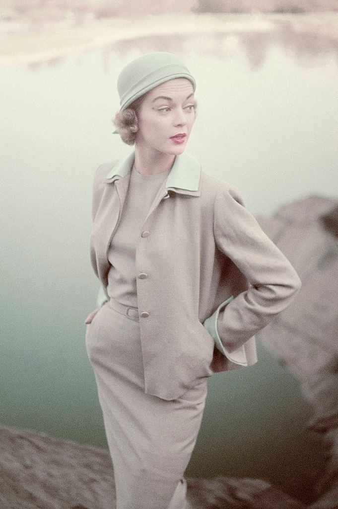 Jean Patchett wearing a Siamese silk plaid bare and bouffant sun dress. Vogue 1951.