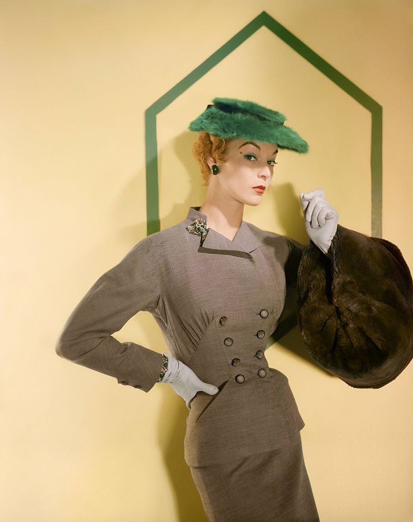 Jean Patchett wearing a pale brown worsted suit, 1953.
