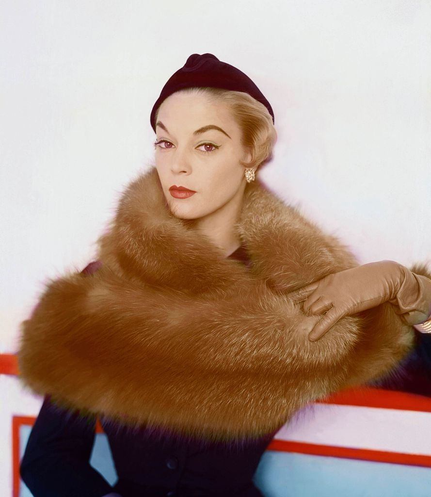 Jean Patchett wearing long haired fur, capeskin gloves by Superb, and black velour cap by Hattie Carnegie, 1953.