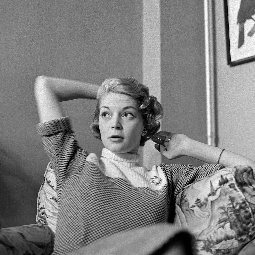 Jean Patchett being photographed at home, 1955.