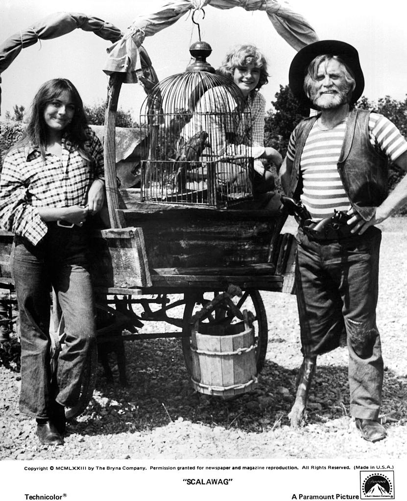 Lesley-Anne Down with actors Mark Lester and Kirk Douglas on set of the Paramount Pictures movie "Scalawag" in 1973.