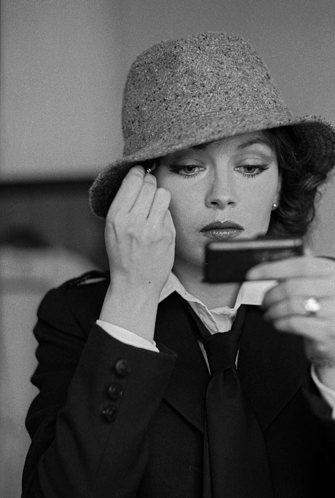Lesley-Anne Down adjusting her make-up on the set of the wartime drama 'Hanover Street', 1979.