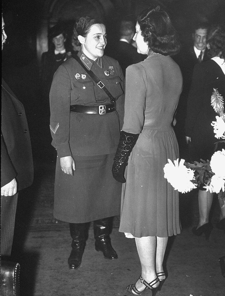 Lyudmila Pavlichenko with Mrs. Ivan Maisky, wife of Russian ambassador to England, during celebration of Soviet Union's 25th anniversary.