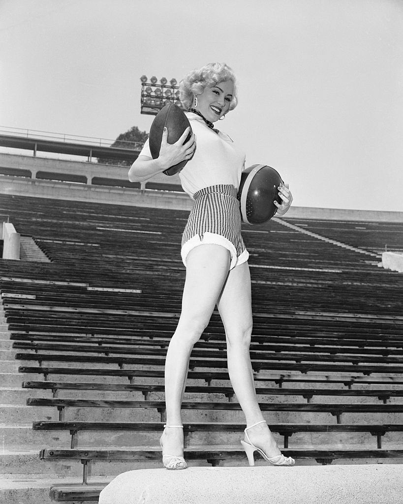 Mamie Van Doren Posing on Bleachers, 1953.
