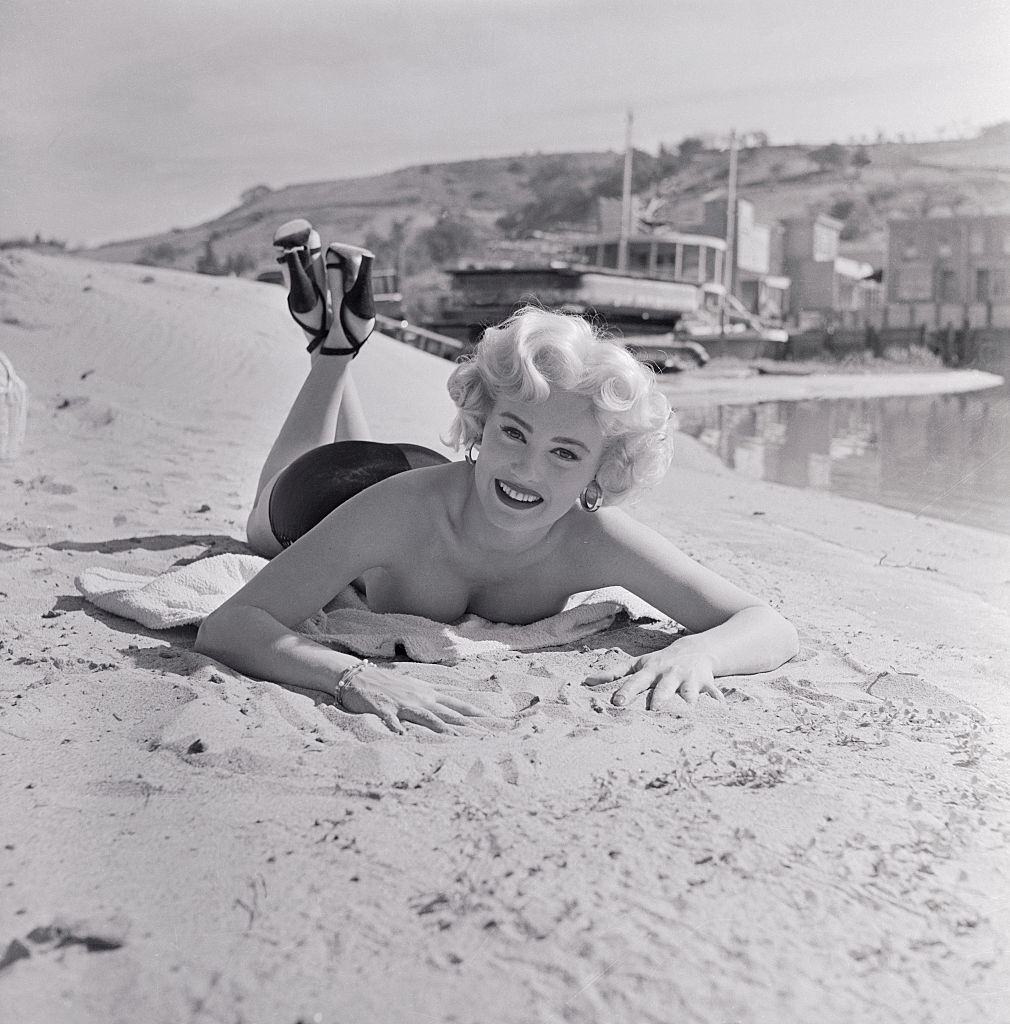 Mamie Van Doren enjoying on the Beach, 1953.