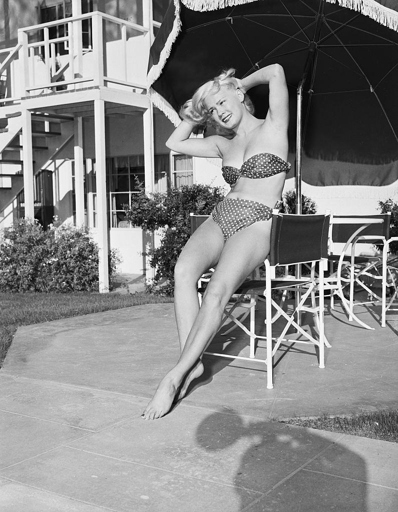 Mamie Van Doren in a bathing suit at California beach, 1953.