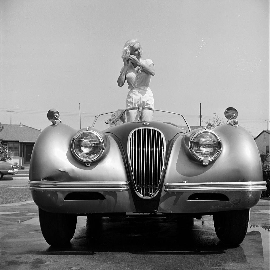 Mamie Van Doren in her Jaguar XK140 in Los Angeles, 1954.