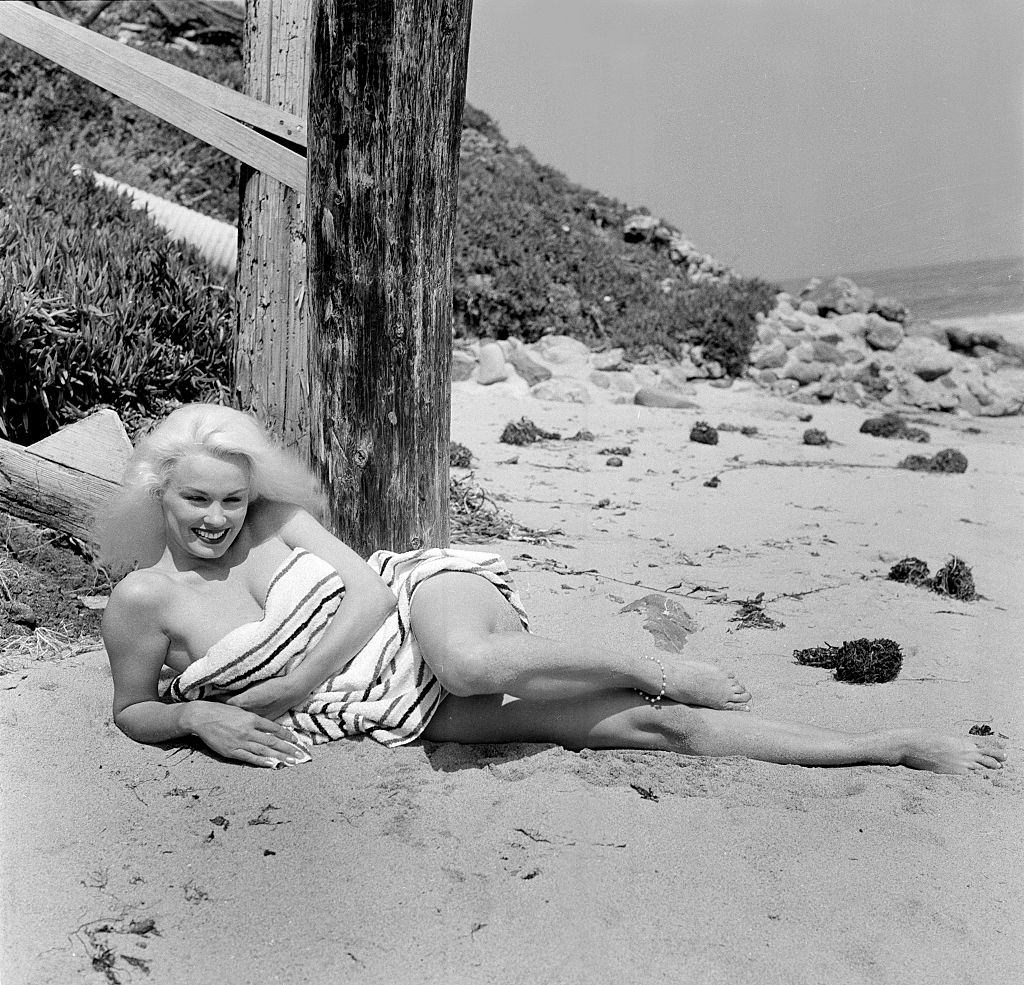 Mamie Van Doren poses at the beach, 1956.