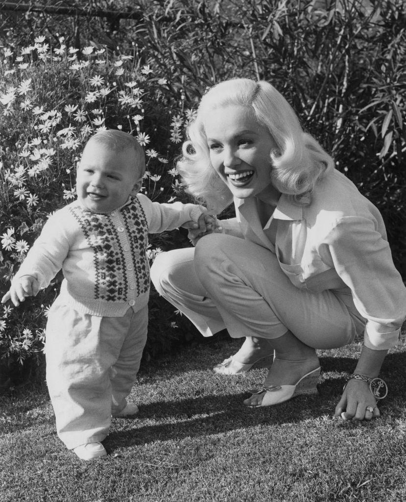 Mamie Van Doren with her 11 month-old son, 1957.