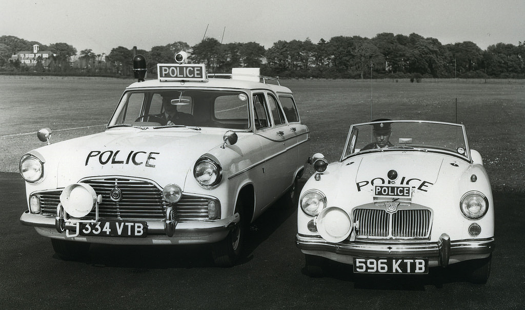 A Ford Zephyr Farnham estate vehicle and an MGA sports car among Lancashire Constabulary police cars of the early 1960s
