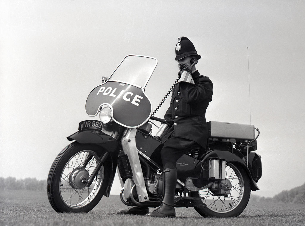 A Manchester City Police officer using his police radio equipment in the early 1960s.