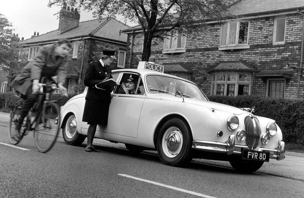 Two Manchester City Police officers on traffic patrol in South Manchester in the 1960s