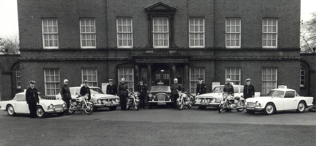 Manchester City Police officers pose proudly with some of the force's vehicles outside Platt Hall in the city's Platt Fields Park, 1961.