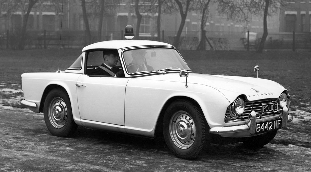 A classic Triumph police car in a Manchester park on an icy day in 1962