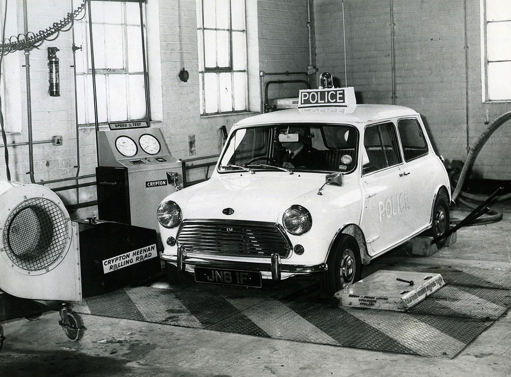 Manchester City Police Mini Cooper undergoing a certified speedometer check on the Force's rolling road at Longsight Police Station in 1968