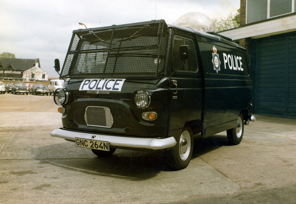 A very early example of a vehicle converted to be used in a public order surveillance role sits in the yard of Longsight Police Station in Manchester, 1974