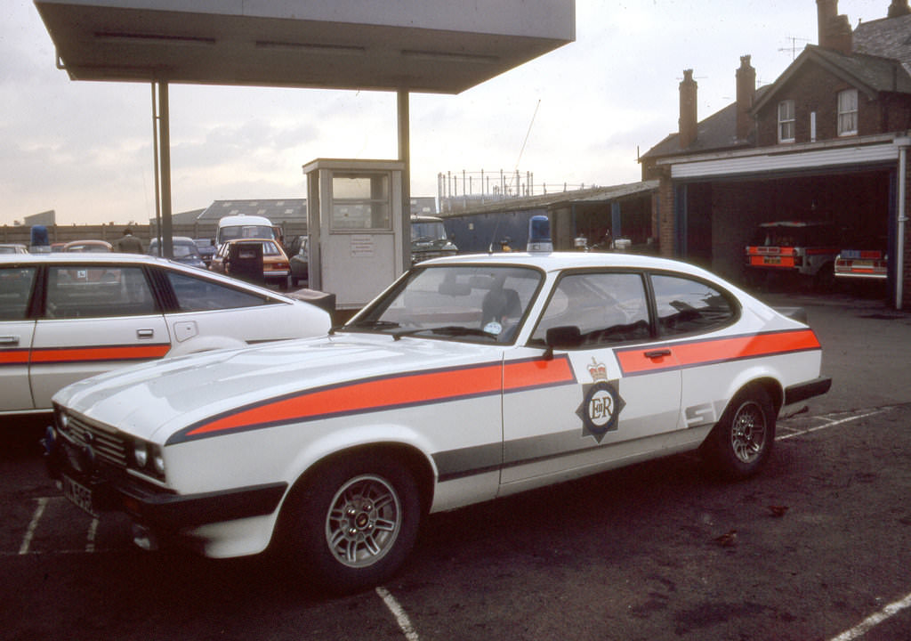 A Ford Capri sits in the yard of the Crescent Police Station in Salford in the late 1980s