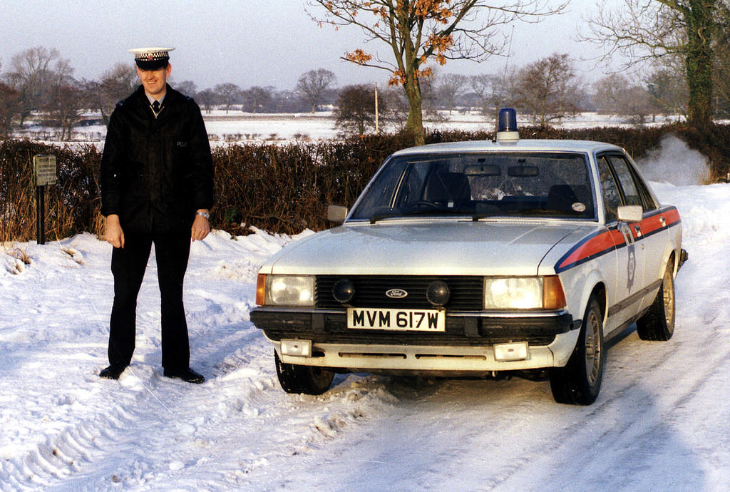 Police officer with his Ford Granada in the early 1980s