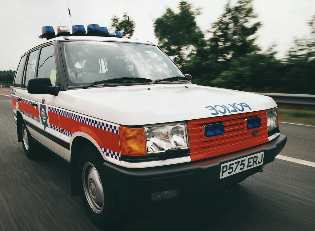 A Greater Manchester Police Motorway Unit Range Rover is at speed during the mid 1990s