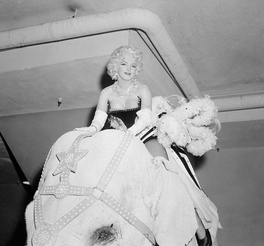 Marilyn Monroe on the elephant at Madison Square.