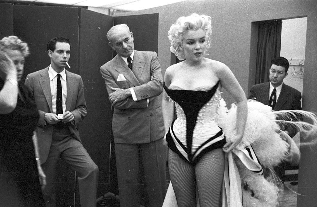 Marilyn Monroe gets fitted for her costume in a dressing room before riding a pink elephant in Madison Square.