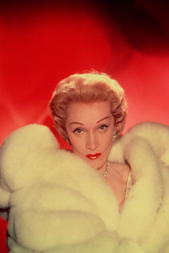 Marlene Dietrich in a big fur coat, 1930s.