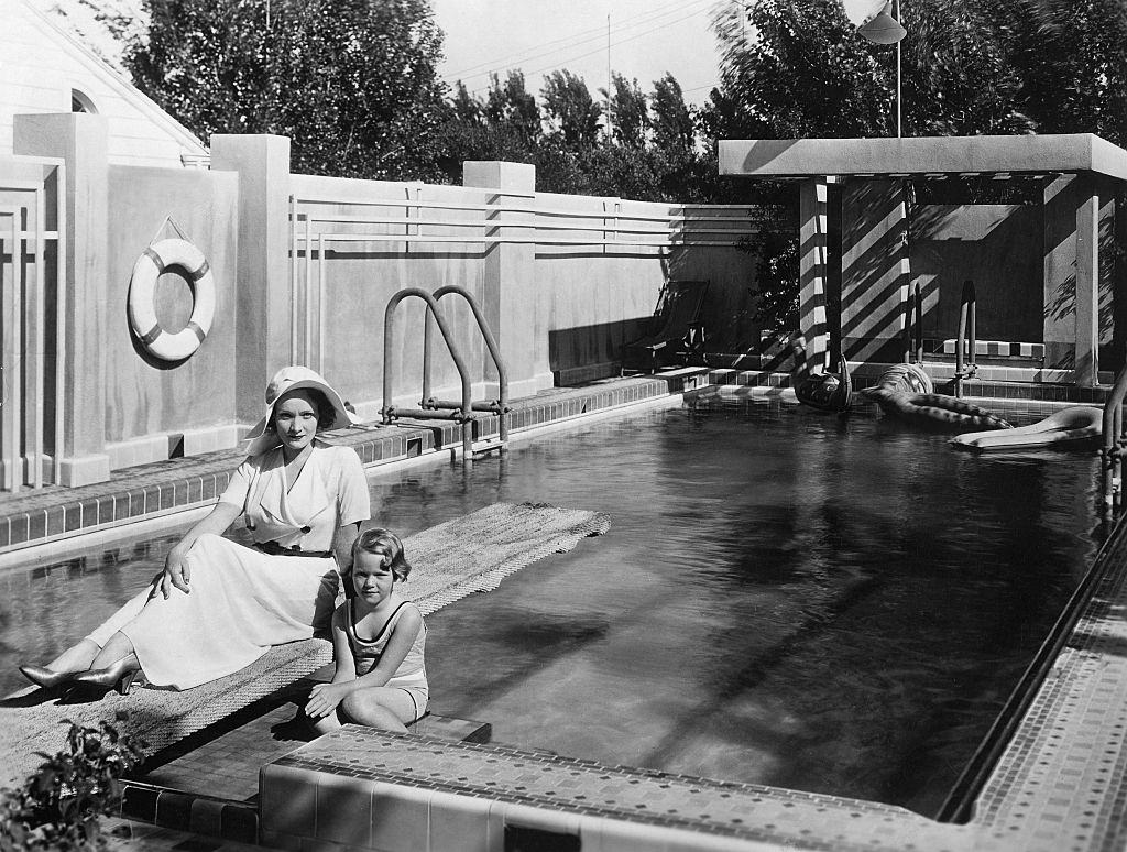 Marlene Dietrich with her daughter Maria at the swimming pool of her villa in Hollywood , 1931.
