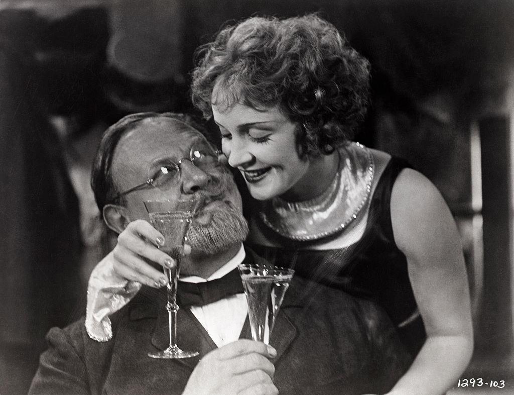 Marlene Dietrich leans over Emil Jannings, 1930.