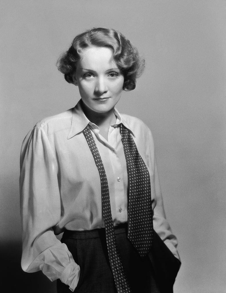 Marlene Dietrich casually dressed in shirt and loosened tie, 1932.
