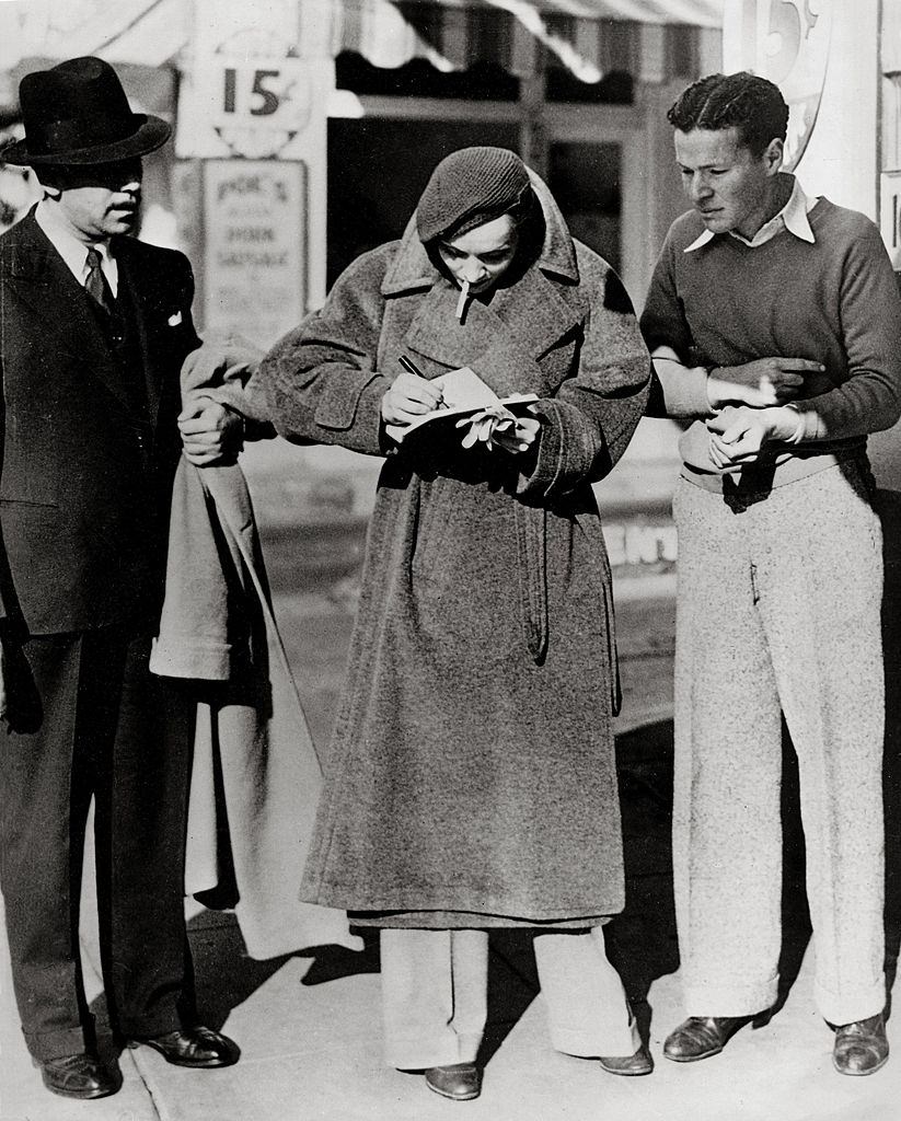 Marlene Dietrich signing autographs at Hollywood Boulevard, 1933.