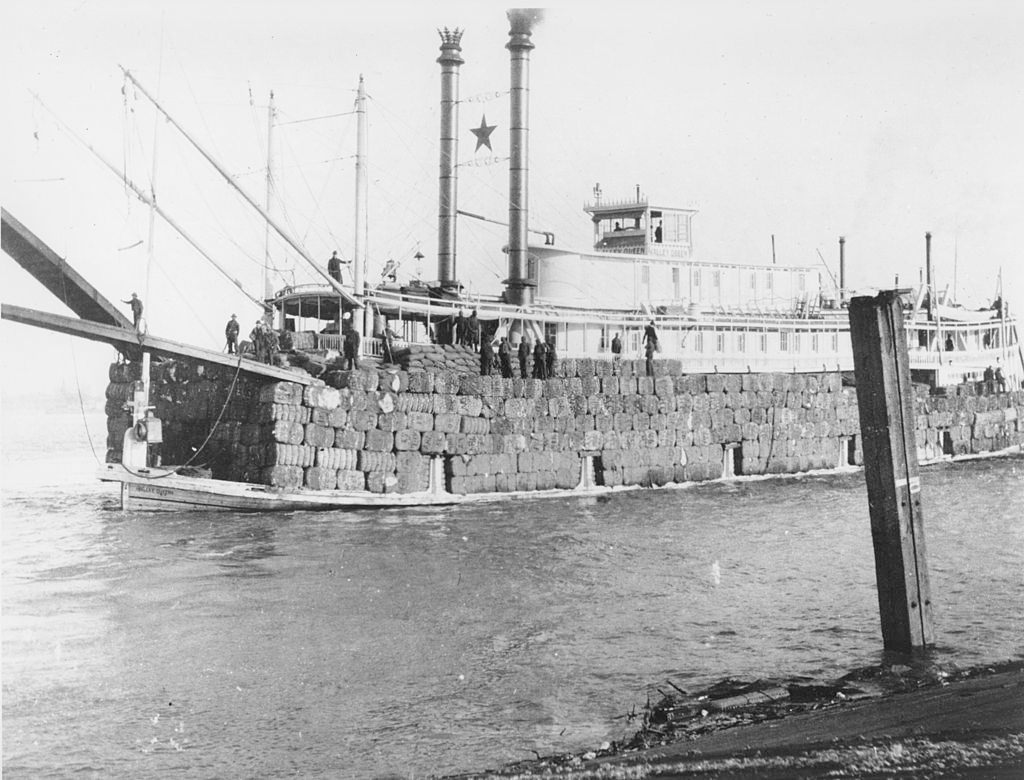 A ship in New Orleans carrying bales of cotton circa 1897.