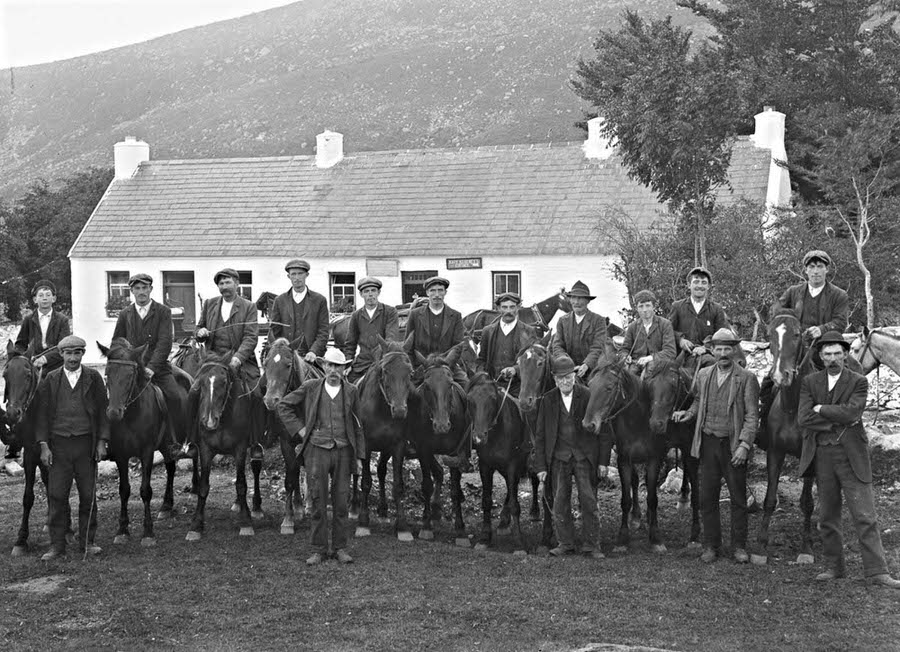 Men on horseback in front of Kate Kearney’s Cottage in Kerry, 1900.