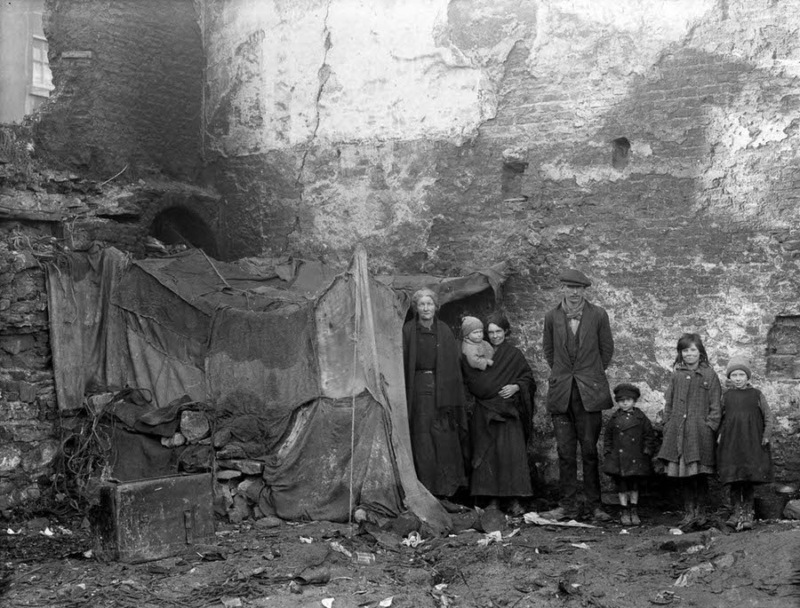 Three generations of a family pose beside their home at Alexander Street, Waterford, 1924.
