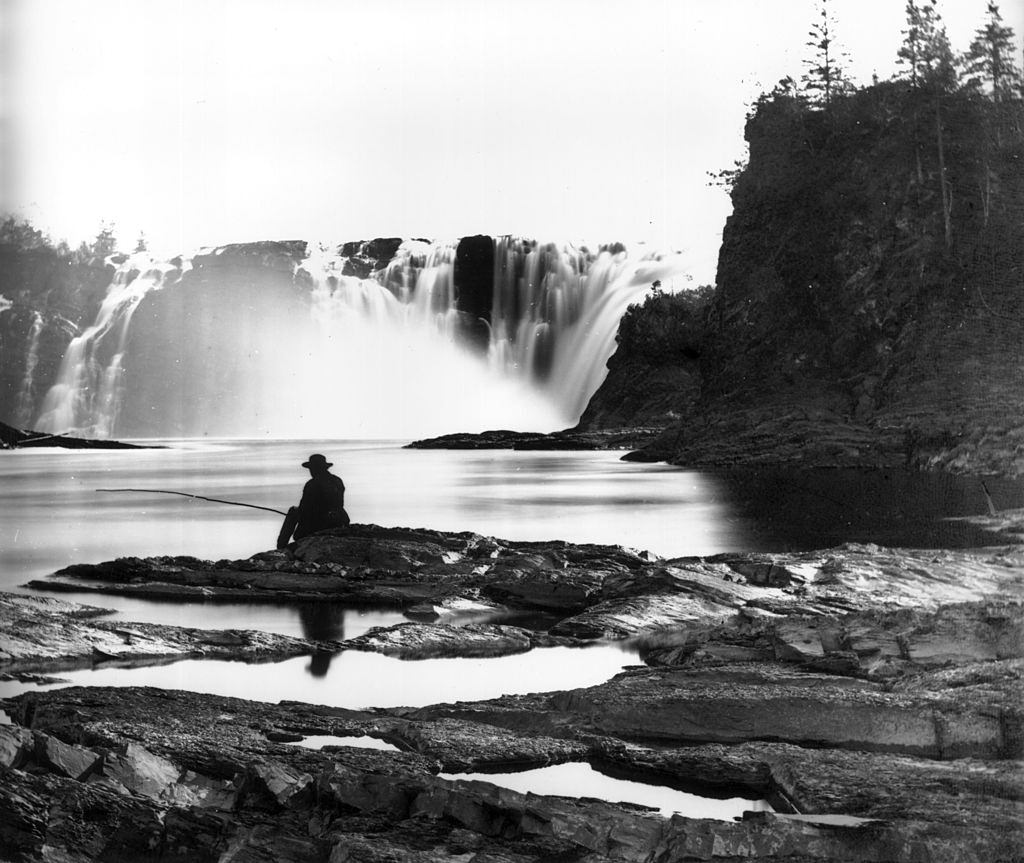 A man fishing near the Chaudiere Falls on the Ottawa River, 1860.