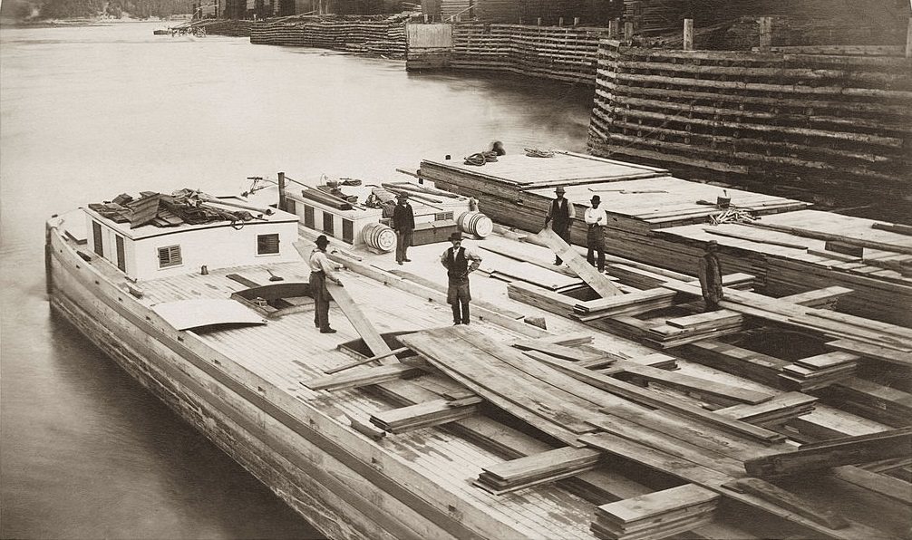 Construction workers on timber transportation boats on the Ottawa River, Ottawa, 1880.