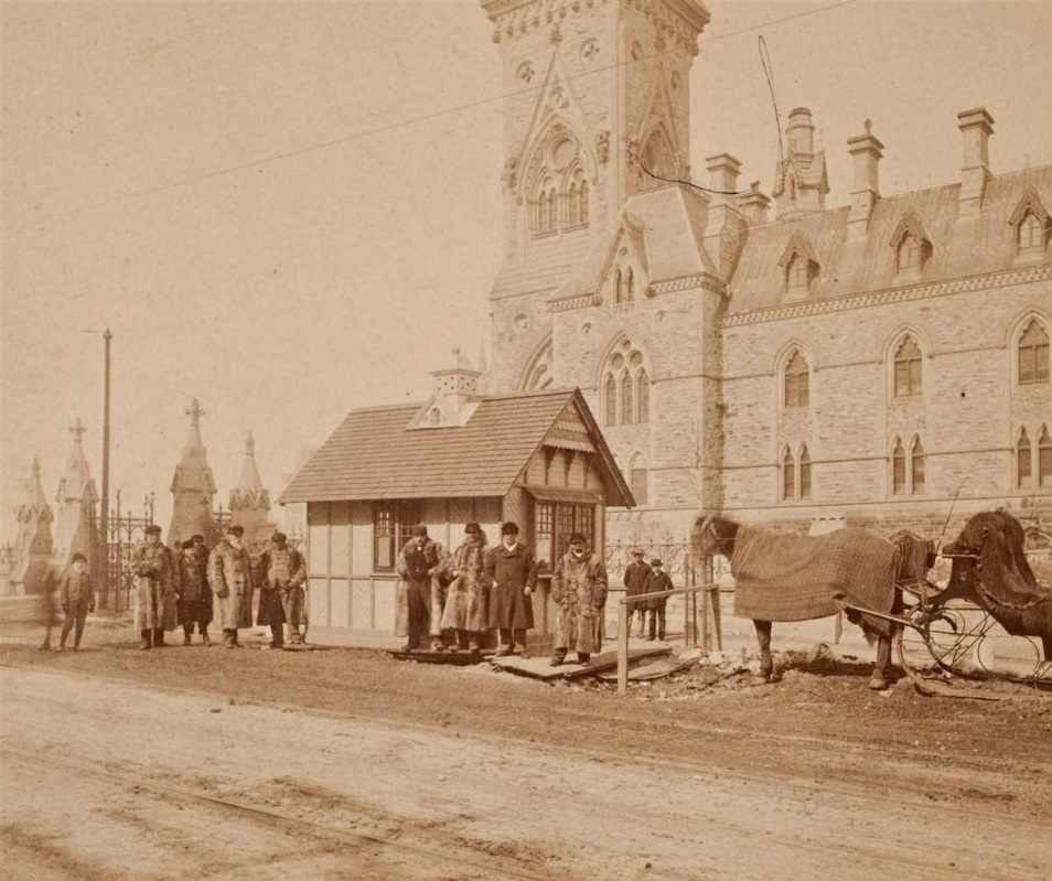 Horse drawn cab stand in front of the East Block, 1897