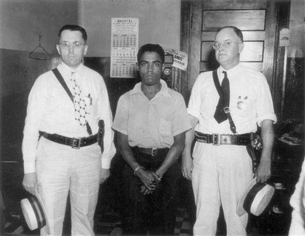 Rainey Bethea with Sheriff’s Deputies Albert Riesz and Lawrence Dishman as they leave the Jefferson County jail in Louisville, Kentucky for his execution in Owensboro, Kentucky.