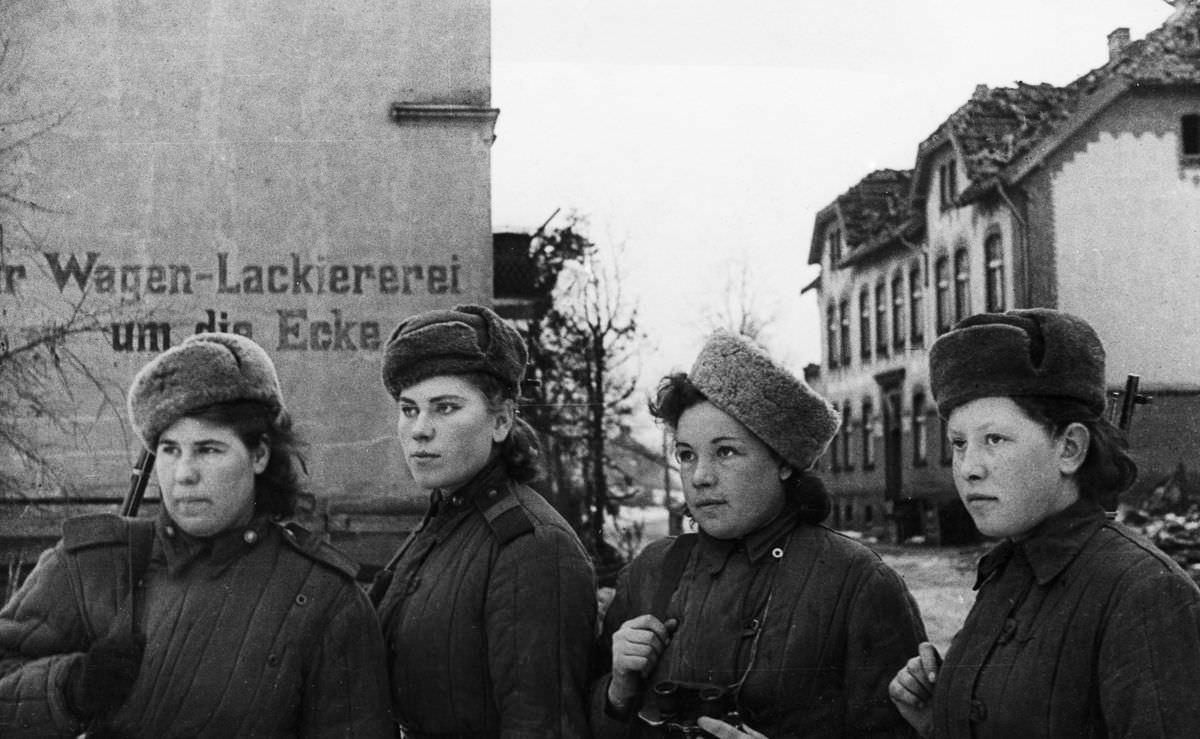 Snipers inspect an East Prussian town recently captured by the Soviets. February 1945