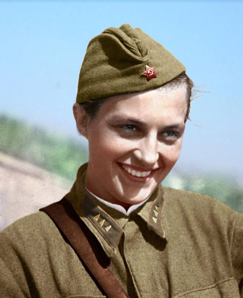 Lyudmila Pavlichenko pictured smiling in her uniform.