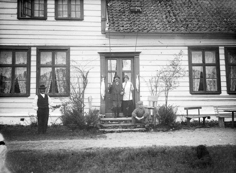 The bailiff's farm, Bruland. Ludvig August Kjær and Magdalene Beyer posing with their catch of the day