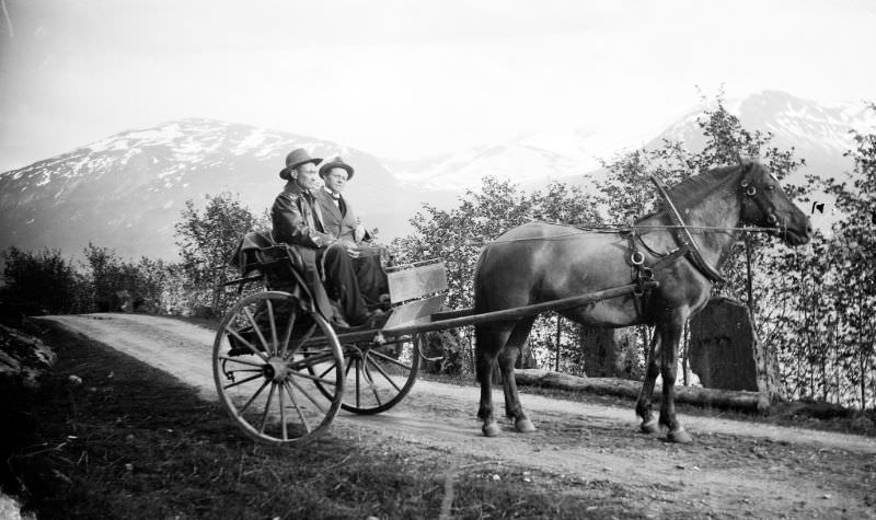 Two men traveling alongside Jølstravatnet lake.