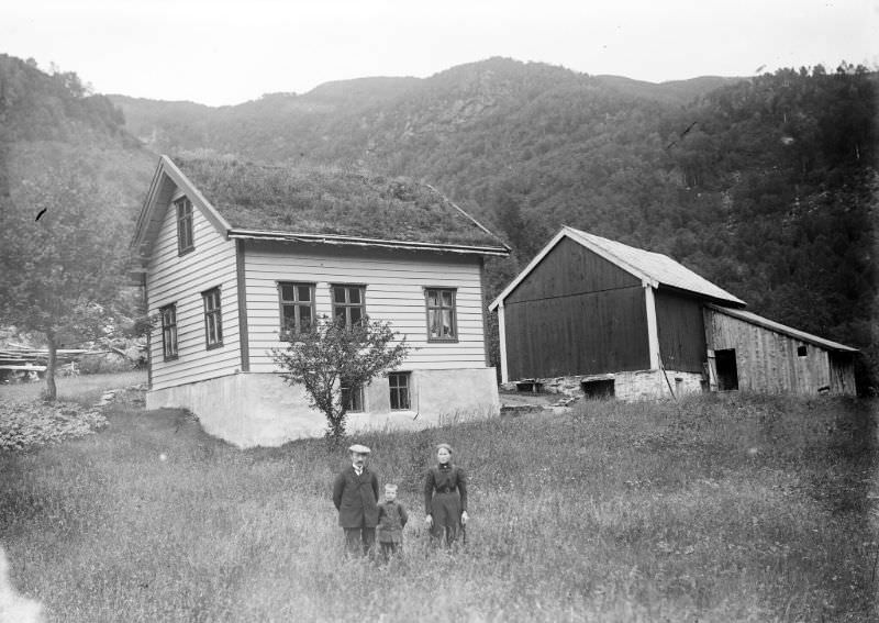 A small family outside their home