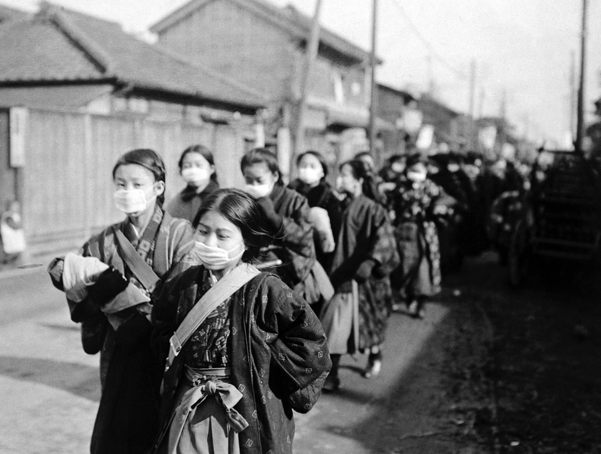 Japanese school girls wear protective masks to guard against the influenza outbreak.