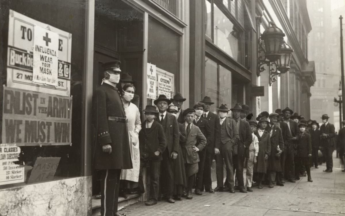 People wait in line to get flu masks on Montgomery Street in San Francisco in 1918.