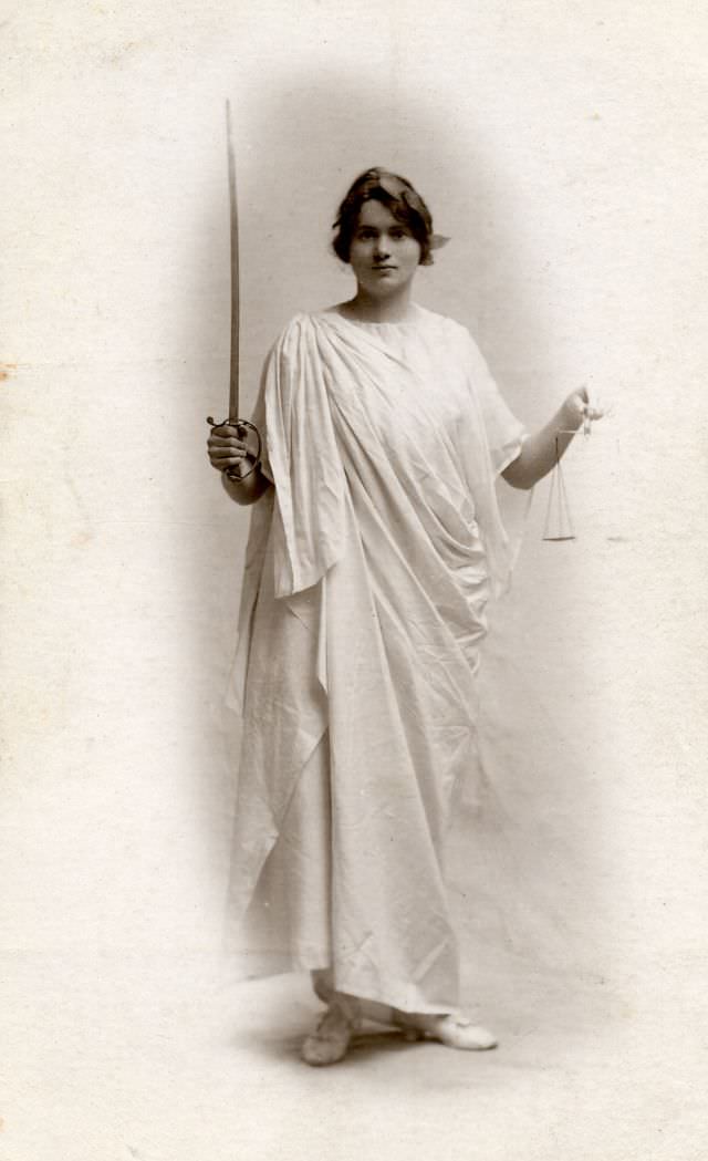 Young woman photographed by the Curzon Studios in London as Justice